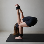 Woman using Muna Magnetic Ankle/Wrist Weight in a yoga pose on a fitness mat.