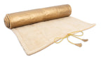 Holistic Silk luxury Yoga Rug Mat rolled out, featuring a golden top and soft beige underside with ties.