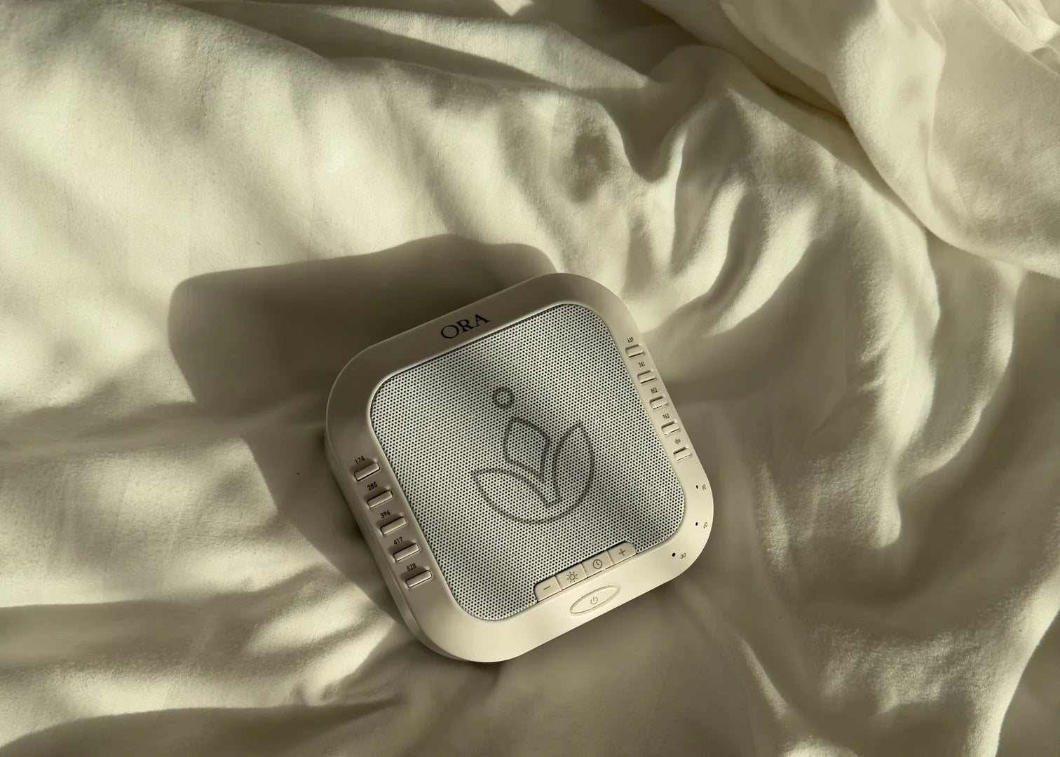 ORA Sound Frequency Machine designed for soothing sound therapy and enhancing calmness in your space.