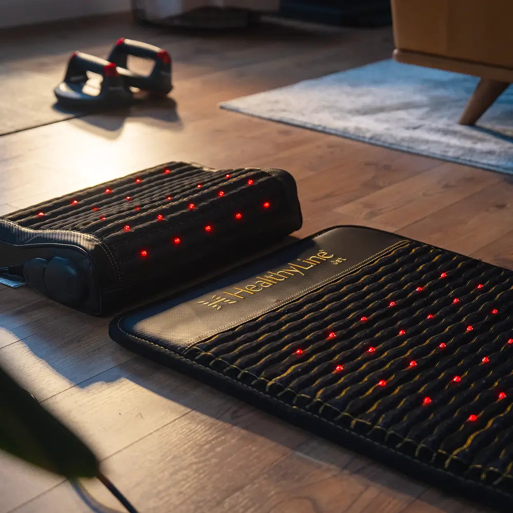 HealthyLine Infrared Pillow on hardwood floor with red light therapy, promoting relaxation and recovery.