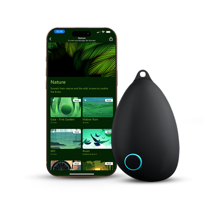 Sensate Vagus Nerve Toning Device next to smartphone showing nature sounds for calming the brain.