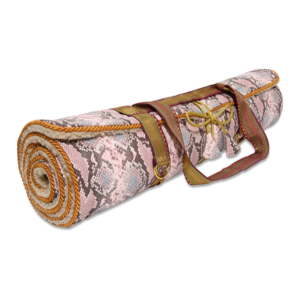 Holistic Silk luxury Yoga Rug Mat rolled up with a stylish handle for easy transport.